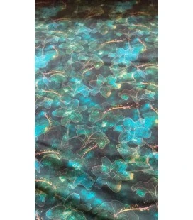 Digitalprintet bomuldsjersey med turkise blomster og gyldne detaljer